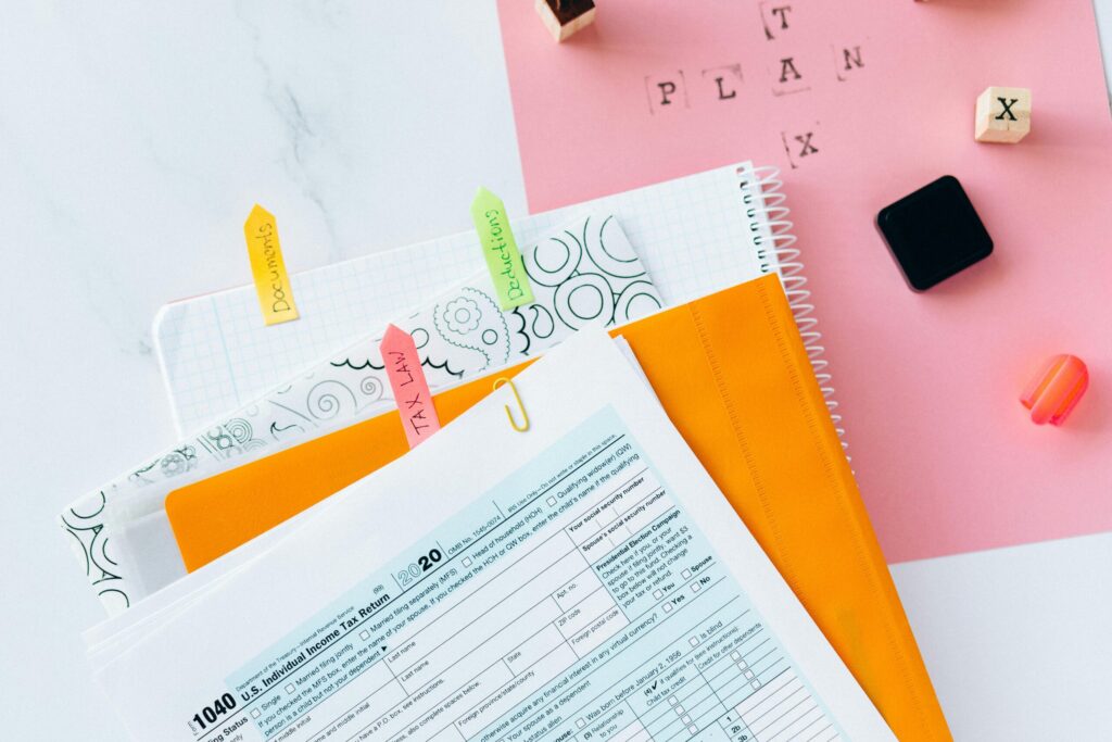 pexels-photo-6863510-6863510 Overhead view of tax documents, forms, and organized work area for tax preparation.